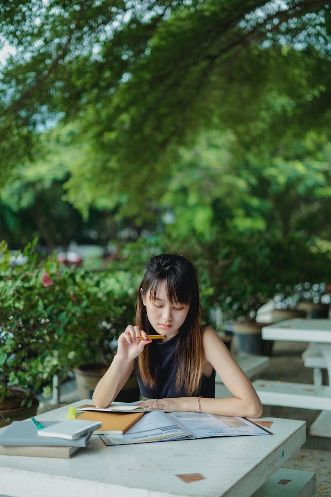 student studying outside